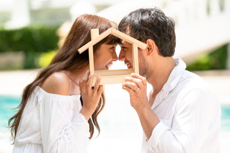 Auction-Bidding-Service-Young Couple Planning To Buy A House Concept.